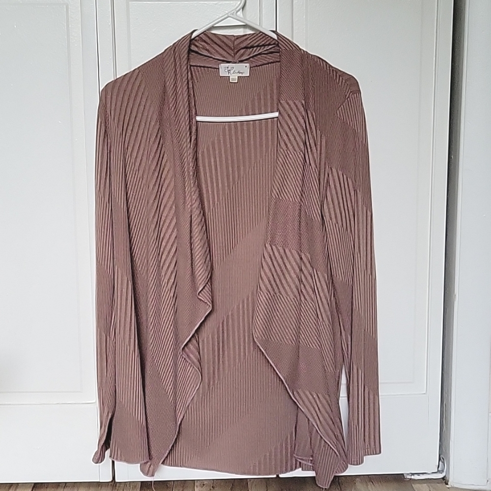NWOT brownish flowy cardigan that has this cool design all over it.